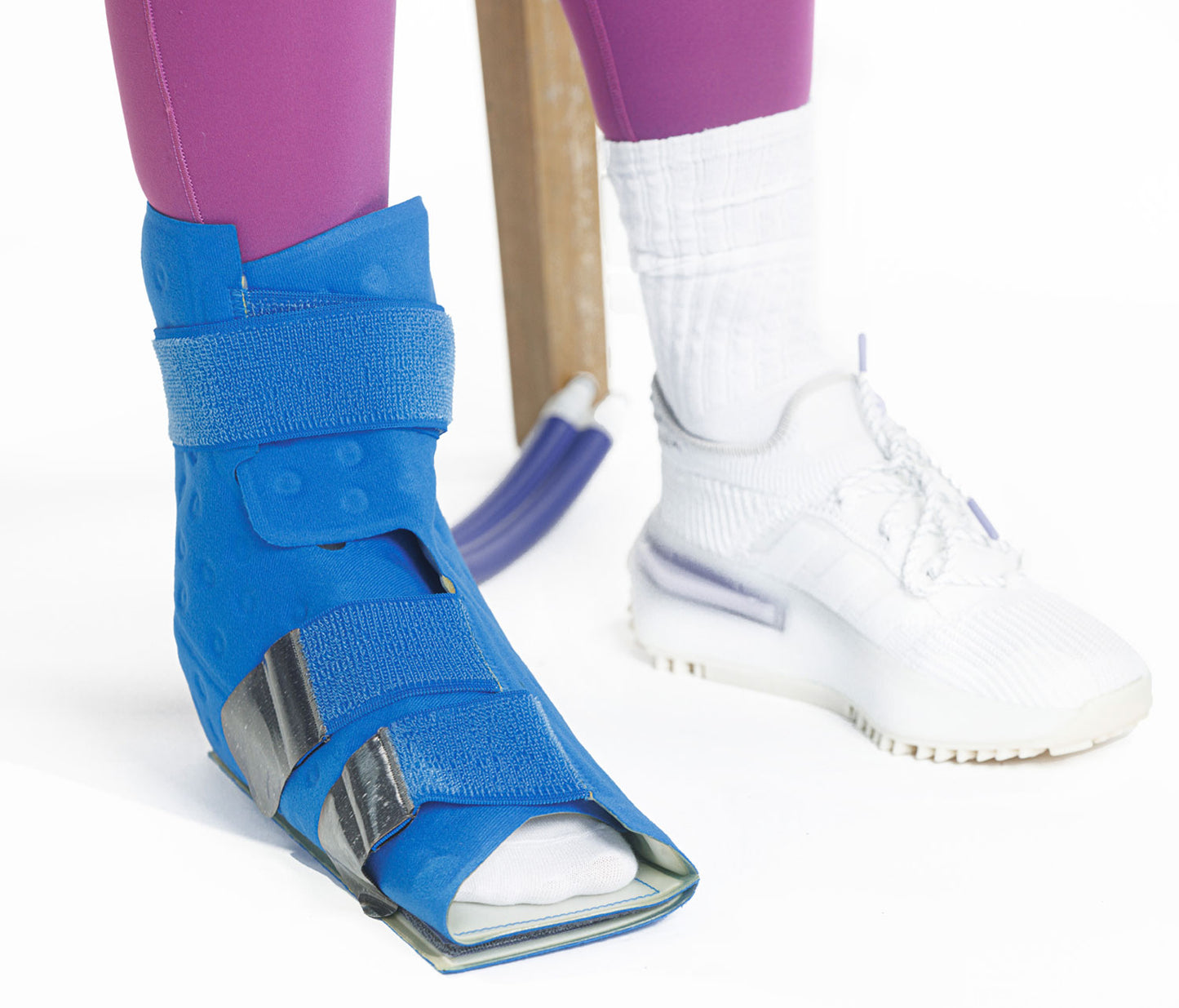 A close up of a foot with a cooling pad on it.